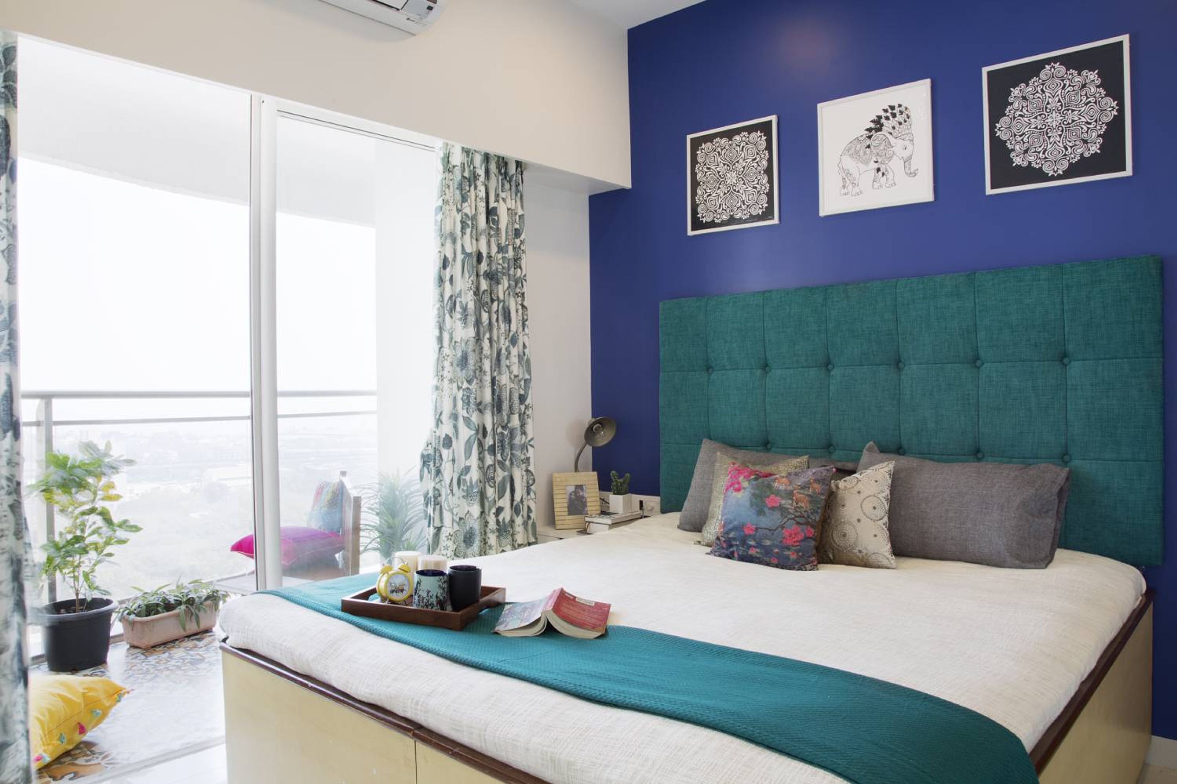 Contemporary 2BHK Flat Design with Blue Accents and Parallel Kitchen