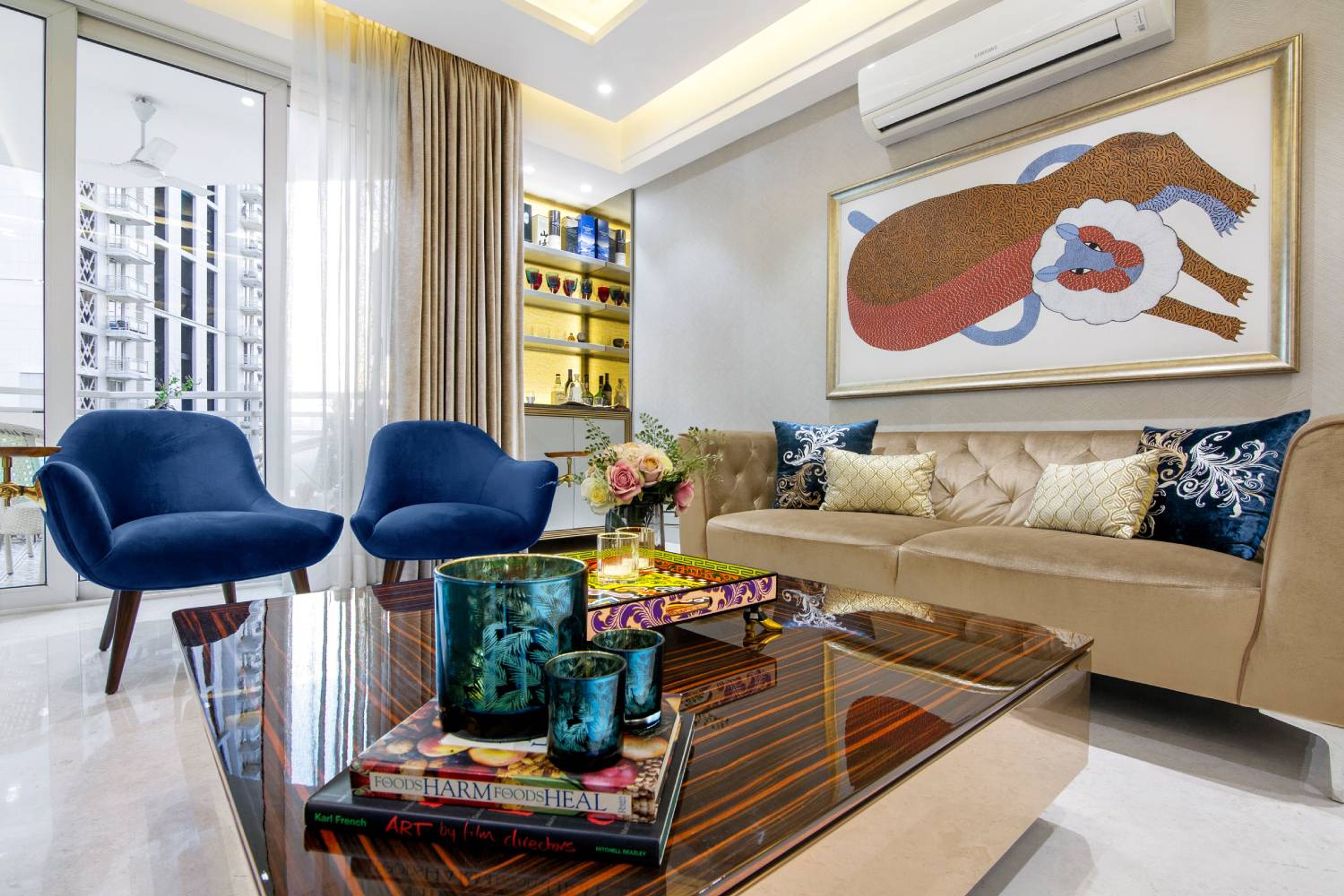 Contemporary 3BHK Flat Design with Beige Sofa and Blue Accent Chairs